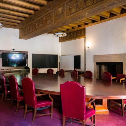 Round conference table with TV at far end