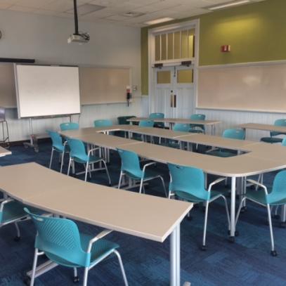 Seating in the round whiteboard and projector at front