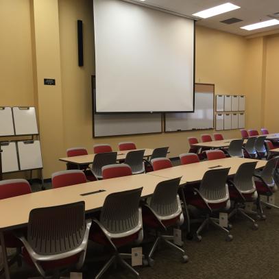 Projection wall with movable tables and chairs