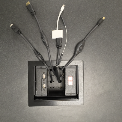 Image of various connection cables at a teaching station