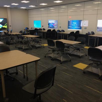 Collaborative area with various seating and group areas with displays