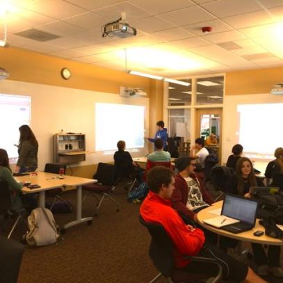 Group work tables with projectors for each