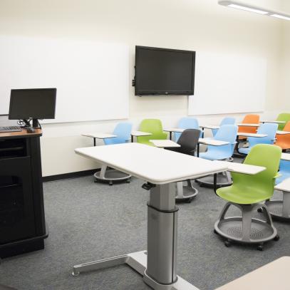 Lectern, mobile desk, display and whiteboards in classroom