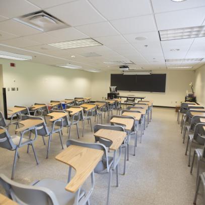 Wide display at the front of single classroom seats